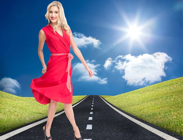 Smiling attractive blonde walking — Stock Photo, Image