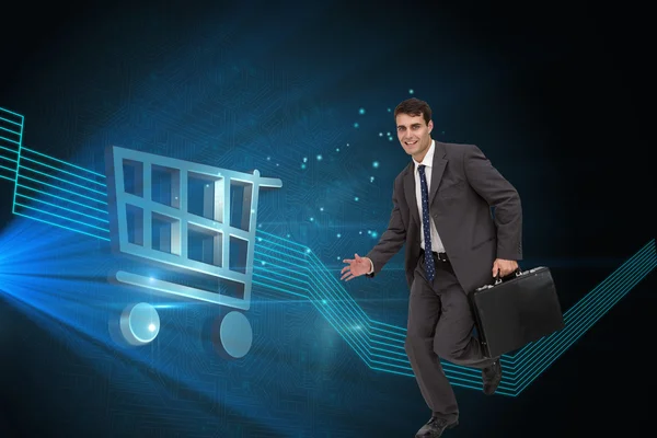 Composite image of smiling businessman in a hurry — Stock Photo, Image