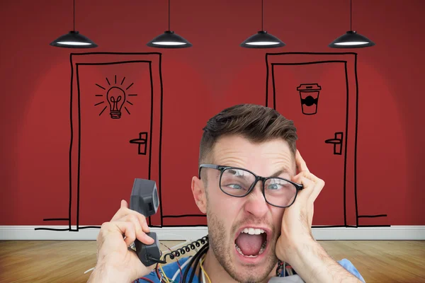 Computer engineer screaming while on call in front of open cpu — Stock Photo, Image