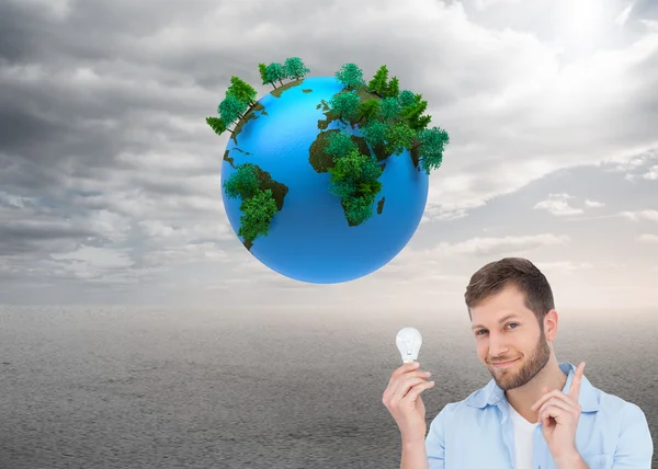 Charming model holding a bulb — Stock Photo, Image