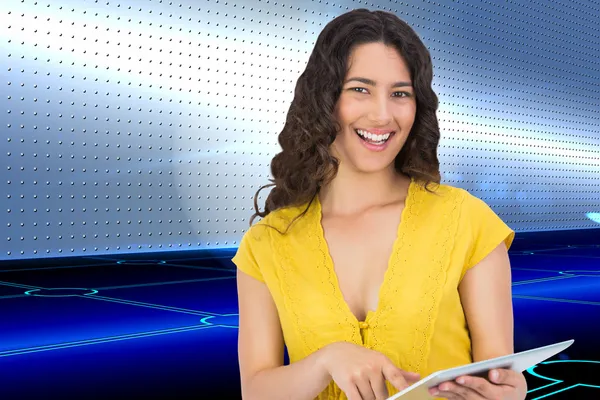 Casual young woman scrolling on her tablet computer — Stock Photo, Image