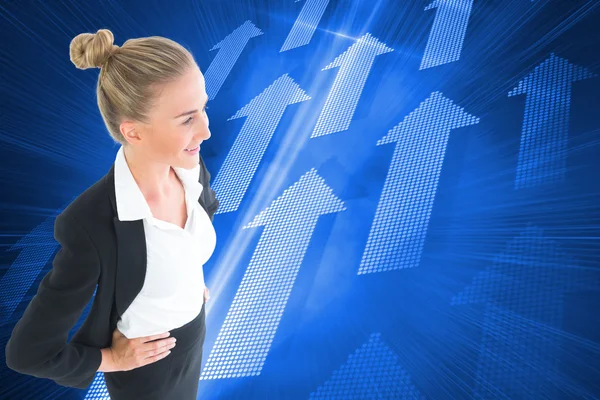 Blonde businesswoman standing with hands on hips — Stock Photo, Image