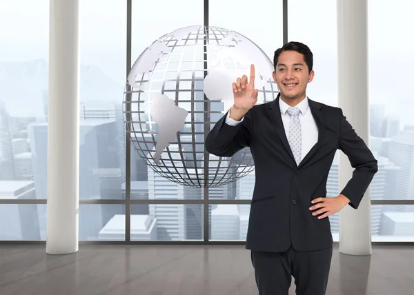 Samengestelde afbeelding van lachende Aziatische zakenman wijzen — Stockfoto