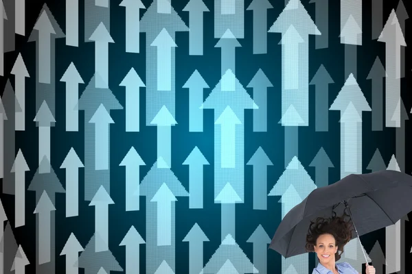 Composite image of happy classy businesswoman jumping while holding umbrella — Stock Photo, Image