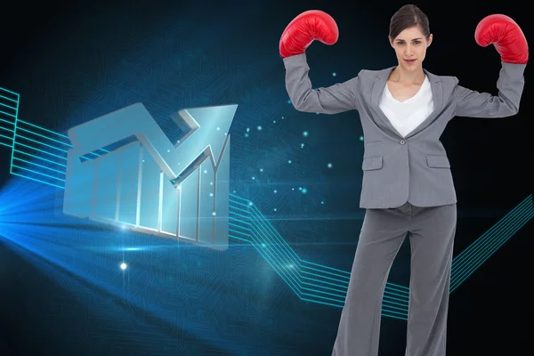 Composite image of businesswoman with boxing gloves — Stock Photo, Image