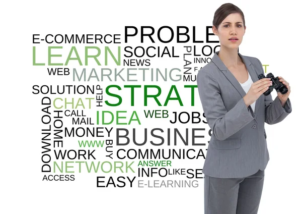 Composite image of curious young businesswoman posing with binoculars — Stock Photo, Image