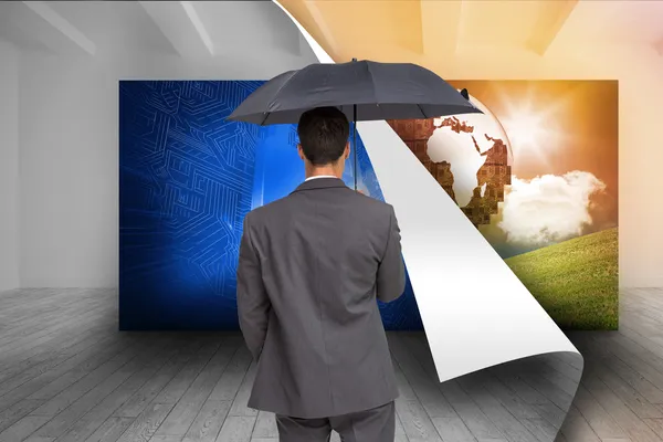 Imagem composta da visão traseira do homem de negócios elegante segurando guarda-chuva cinza — Fotografia de Stock