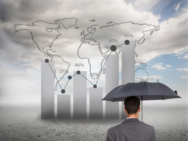 Samengestelde afbeelding van Achteraanzicht van stijlvolle zakenman houden grijs paraplu — Stockfoto