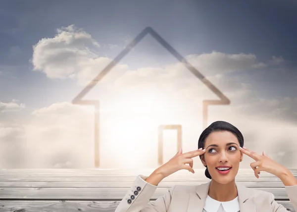 Composite image of confident young businesswoman — Stock Photo, Image