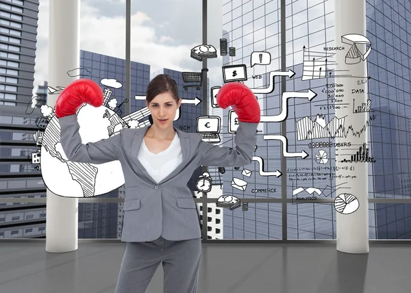 Composite image of businesswoman with boxing gloves — Stock Photo, Image