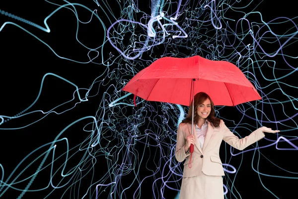 Imagen compuesta de la feliz empresaria sosteniendo el paraguas —  Fotos de Stock