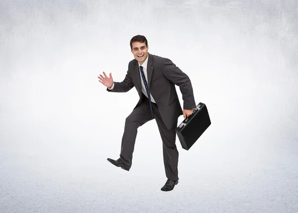 Cheerful businessman in a hury — Stock Photo, Image