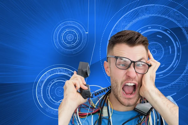 Computer engineer screaming while on call in front of open cpu — Stock Photo, Image