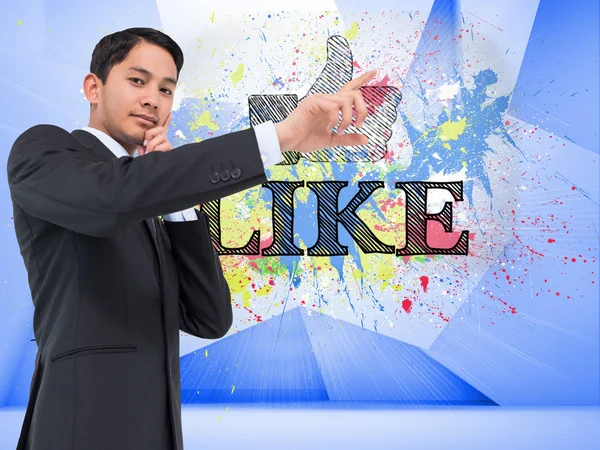 Composite image of thoughtful asian businessman pointing — Stock Photo, Image