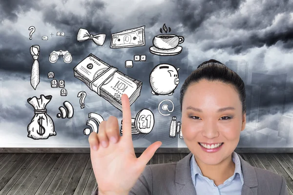 Composite image of smiling asian businesswoman pointing — Stock Photo, Image