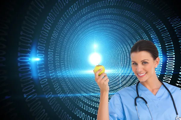 Surgeon holding an apple — Stock Photo, Image