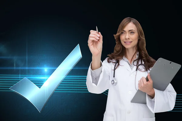 Composite image of smiling doctor pointing — Stock Photo, Image