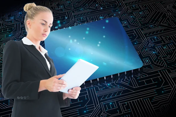 Composite image of businesswoman holding tablet — Stock Photo, Image