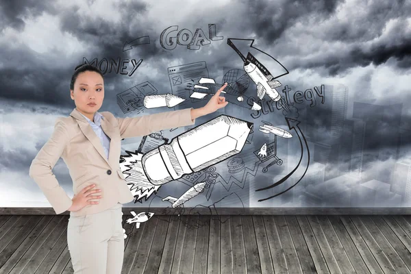 Composite image of unsmiling asian businesswoman pointing — Stock Photo, Image