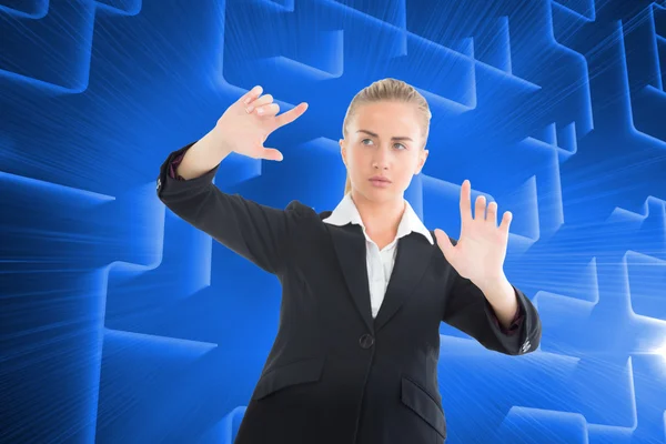 Composite image of businesswoman pointing somewhere — Stock Photo, Image