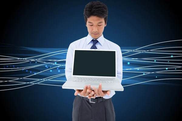 Businessman showing a laptop — Stock Photo, Image