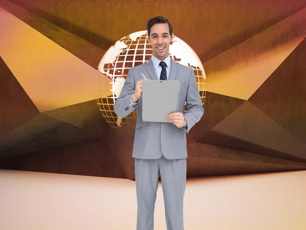 Happy businessman holding a clipboard — Stock Photo, Image