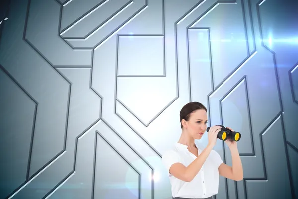 Composite image of serious elegant businesswoman looking through — Stock Photo, Image