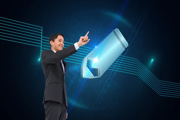 Composite image of smiling asian businessman pointing — Stock Photo, Image