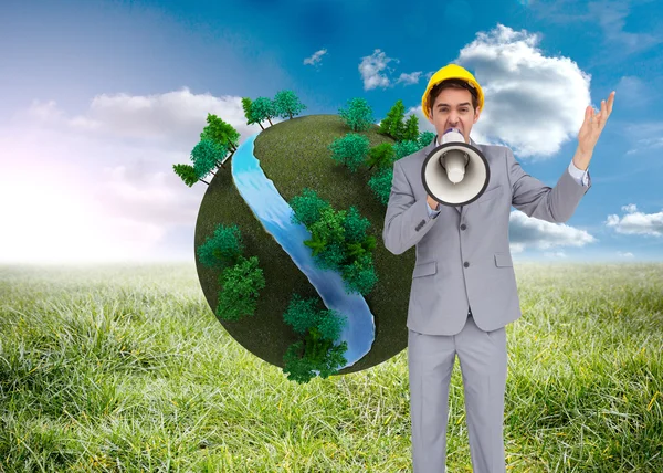 Architect with hard hat shouting with a megaphone — Stock Photo, Image