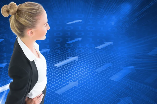 Composite image of businesswoman standing with hands on hips — Stock Photo, Image