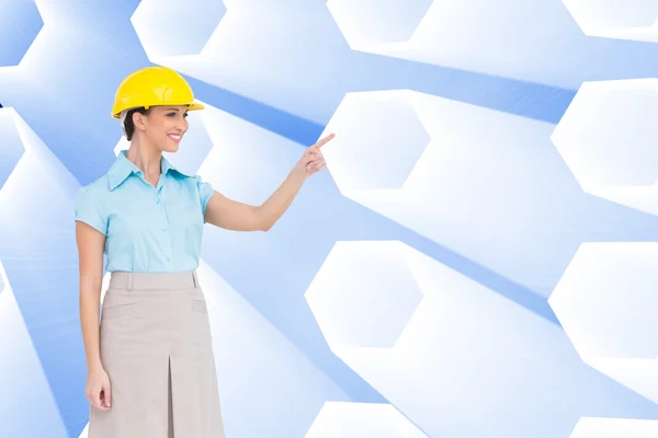 Smiling attractive architect pointing — Stock Photo, Image