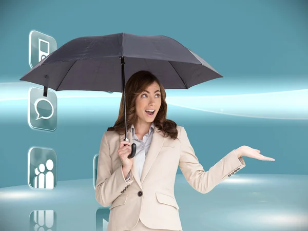 Businesswoman holding black umbrella — Stock Photo, Image