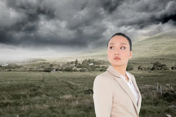 Composite image of unsmiling asian businesswoman — Stock Photo, Image