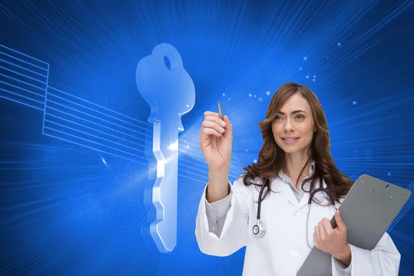 Composite image of smiling doctor pointing — Stock Photo, Image