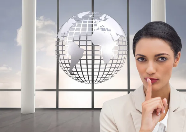 Composite image of young businesswoman asking for silence — Stock Photo, Image