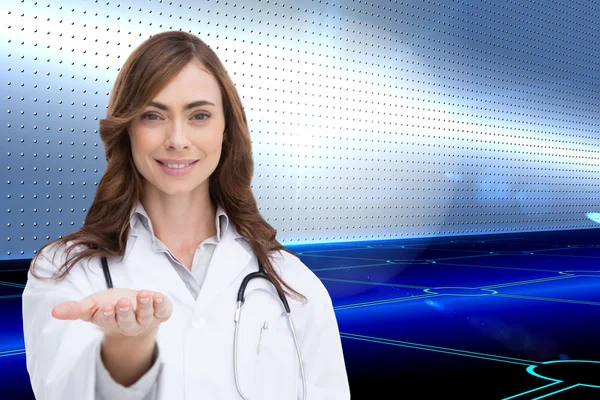 Portrait of female nurse holding out open palm — Stock Photo, Image