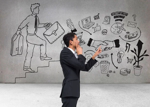 Composite image of thoughtful asian businessman pointing — Stock Photo, Image