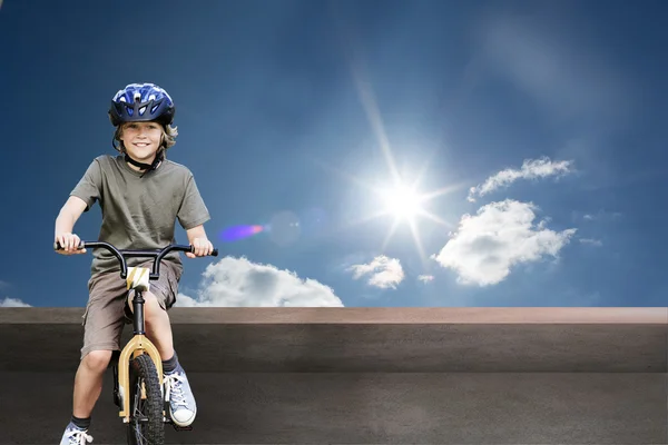 Little boy with his bike in a park — Stock Photo, Image