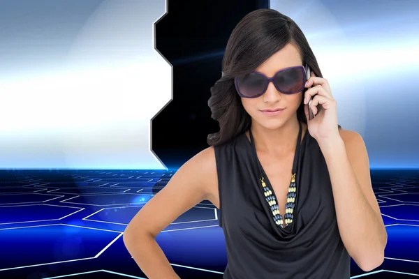 Brunette wearing sunglasses on the phone — Stock Photo, Image