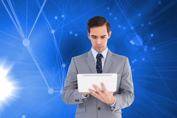 Businessman holding a tablet computer — Stock Photo, Image