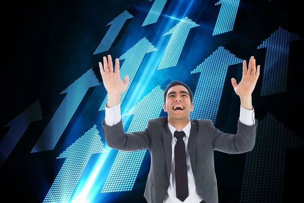 Composite image of excited businessman with arms raised — Stock Photo, Image