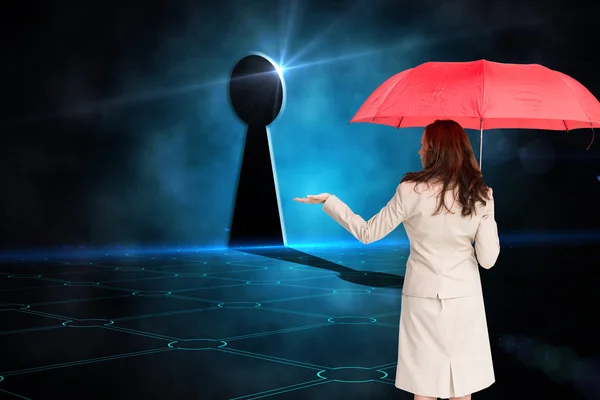 Image composite de femme d'affaires tenant parapluie — Photo