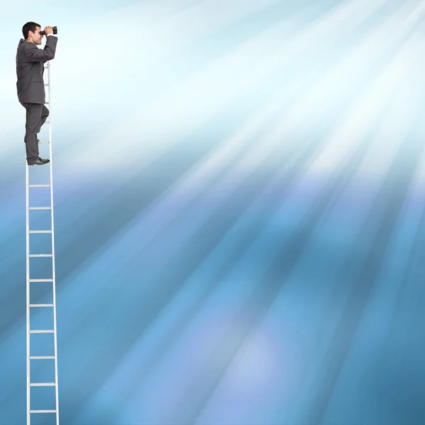 Businessman standing on ladder using binoculars — Stock Photo, Image