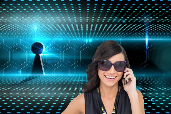 Composite image of happy brunette phoning — Stock Photo, Image