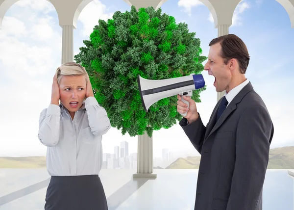 Businessman shouting at colleague with his bullhorn — Stock Photo, Image