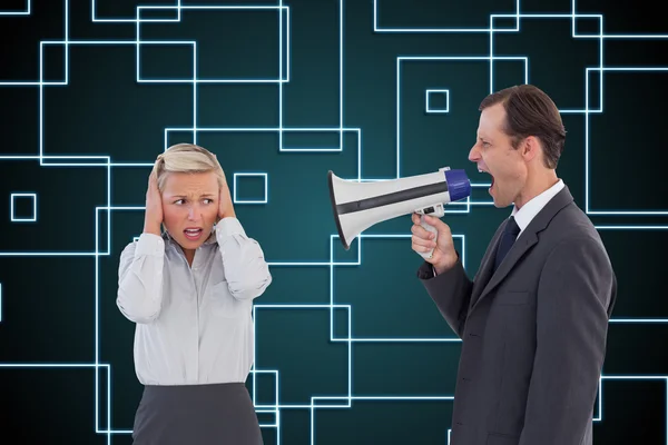 Businessman shouting at colleague with his bullhorn — Stock Photo, Image