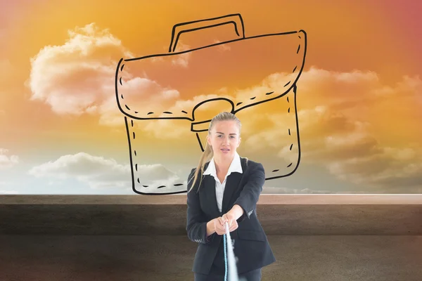 Composite image of businesswoman pulling a rope — Stock Photo, Image