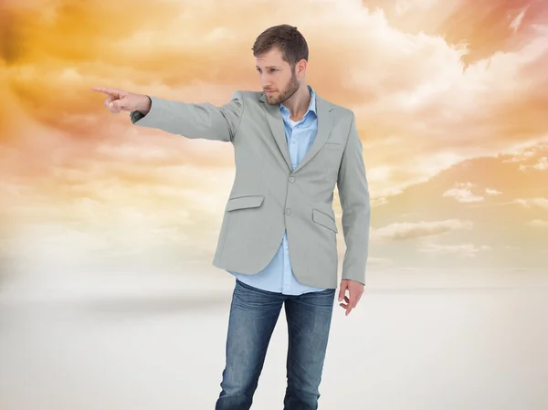 Trendy model pointing to something — Stock Photo, Image