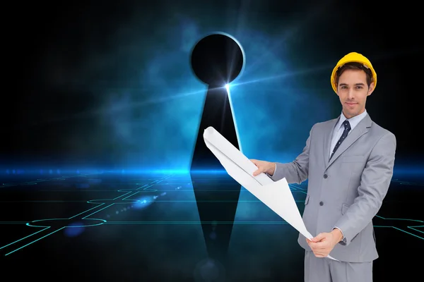 Serious architect with hard hat holding plans — Stock Photo, Image