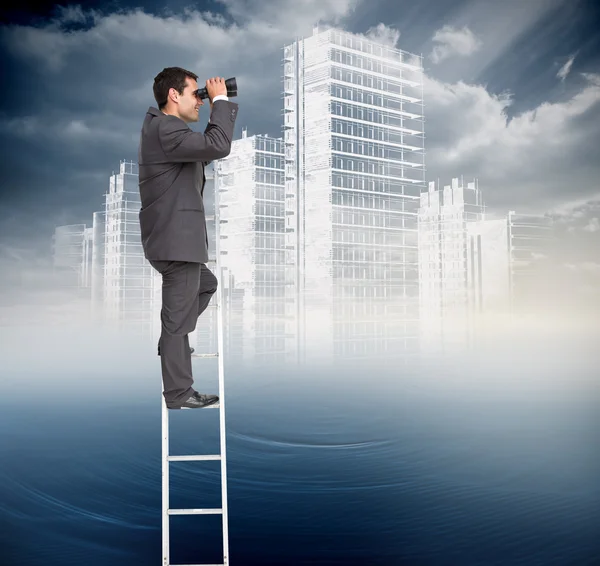 Businessman standing on ladder — Stock Photo, Image